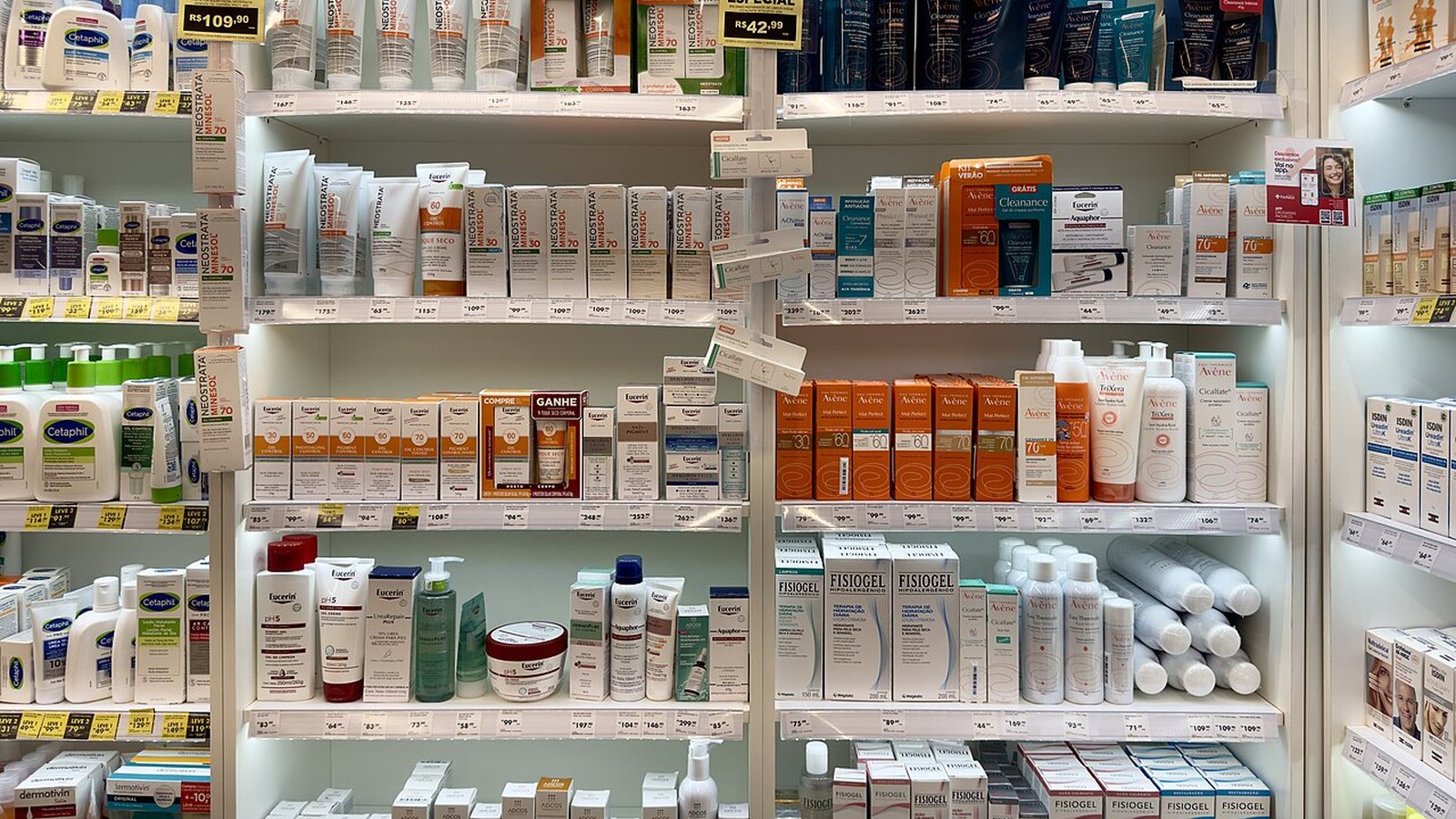 Shelves filled with skincare and personal care products in a pharmacy